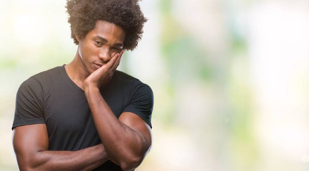 Afro american man over isolated background thinking looking tired and bored with depression problems with crossed arms. - Фото, зображення