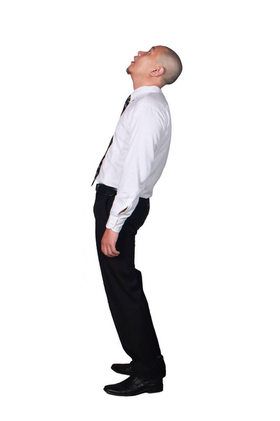 Young businessman wearing white suit and black pants deperate, looking up gesture. Isolated on white. Full body portrait - Photo, Image