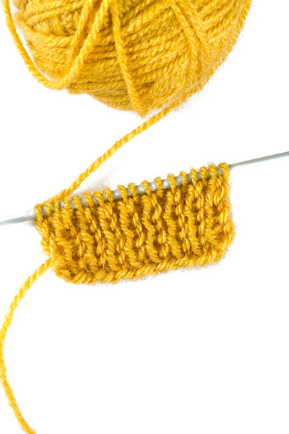 yellow thread and knitting needle isolated on white - Zdjęcie, obraz
