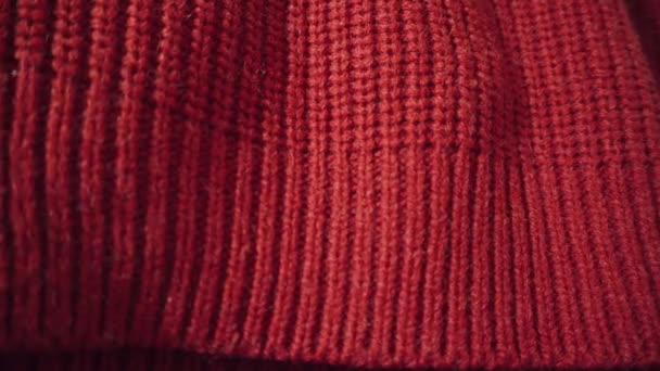 Rode wol of acryl achtergrond gebreide textuur. Kan worden gebruikt als achtergrond. - Video
