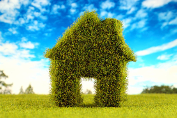 Groene huisje met veld en blauwe hemelachtergrond. Eco hernieuwbare energieconcept. Elektriciteitsprijzen, energiebesparing in het huishouden. - Foto, afbeelding