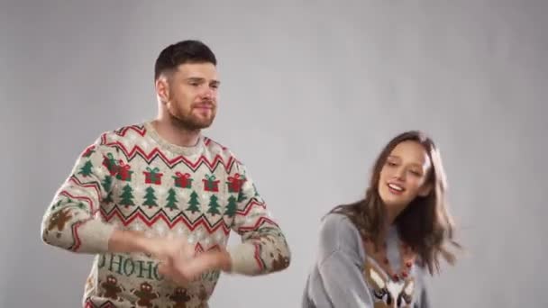 happy couple dancing at christmas party - Materiał filmowy, wideo