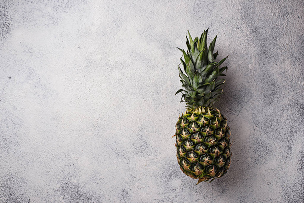Pineapple on gray concrete background - Photo, Image