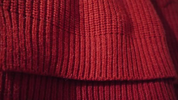 Red knitted texture. Can be used as background. Warm scarf or sweater for the winter season. 4k resolution. - Footage, Video