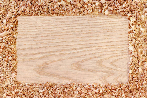wood sawdust on wooden background with free copy space - Φωτογραφία, εικόνα