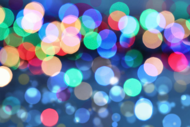 Festive background with beautiful bright bokeh effect. Design for different holidays, Christmas or New Year - Foto, Bild