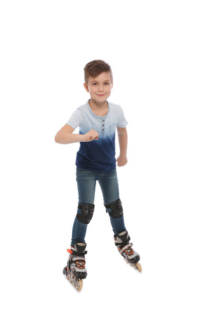 Little boy with inline roller skates on white background - Φωτογραφία, εικόνα