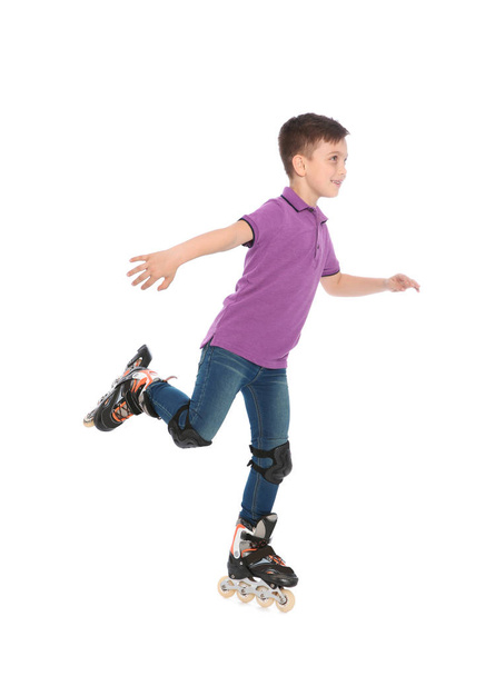 Little boy with inline roller skates on white background - Фото, изображение