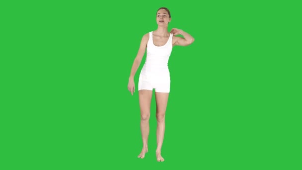 Young blonde woman with happy face smiling doing ok sign on a Green Screen, Chroma Key. - Footage, Video