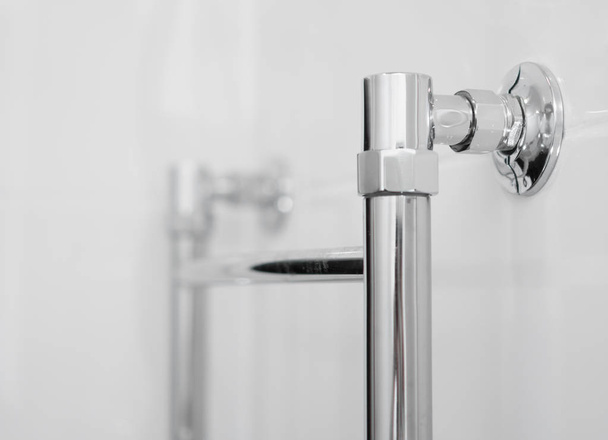 Close-up view of Heated towel rail in bathroom. - Fotoğraf, Görsel