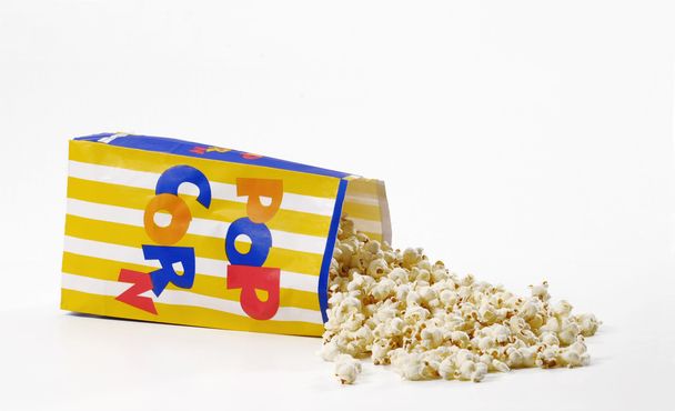 Popcorn bag on white background. - Фото, зображення