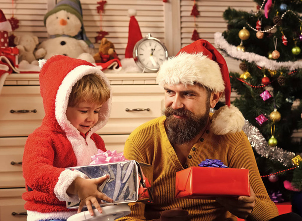 Christmas happy child and father with present box. - Фото, зображення