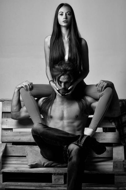 young couple on wooden sofa - Foto, Imagem