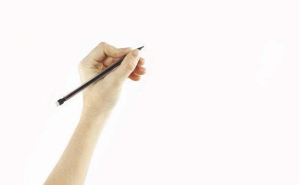 Tytön käsi kirjoittaa tyhjään tilaan eristetty valkoisella taustalla
 - Valokuva, kuva