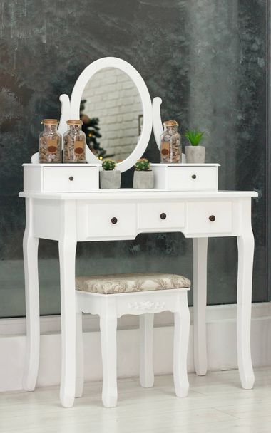white beauty vintage pier glass with an oval mirror with a chair indoors - Fotoğraf, Görsel
