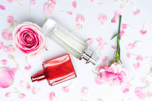Beautiful perfume bottles on pink background - Photo, Image