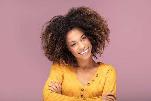 Young afro american woman posing over pink background smiling . Human emotions. - Valokuva, kuva