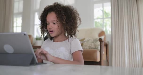 African American girl using digital tablet for homework - Filmati, video