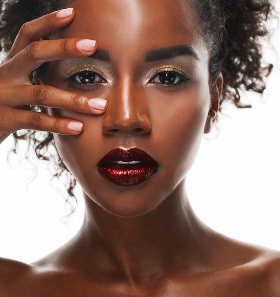 Portrait of Young African model with a beautiful makeup in studio - Foto, afbeelding
