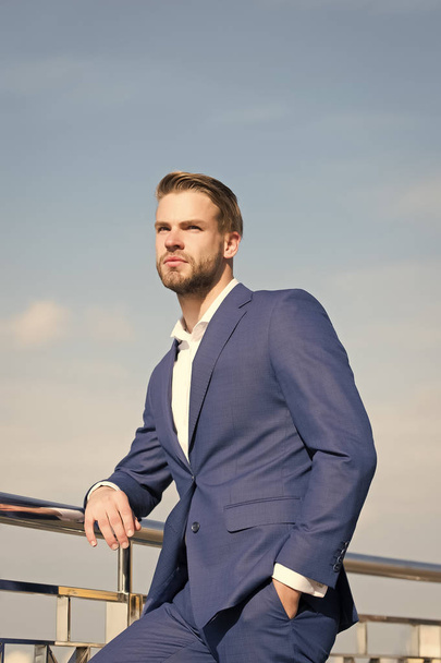 Businessman stand on blue sky, success, ambition, freedom, achievement - Fotografie, Obrázek