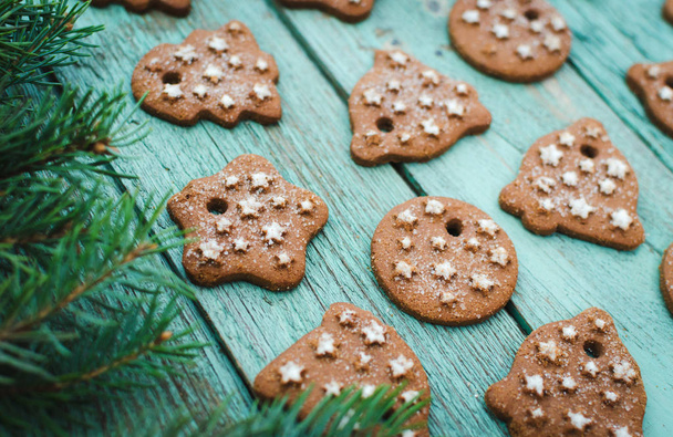 Christmas wooden background with cookies. Turquoise wooden table. - Fotó, kép