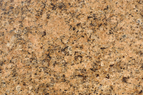 Natural stone polished granite, called Tiger Gold. - Φωτογραφία, εικόνα