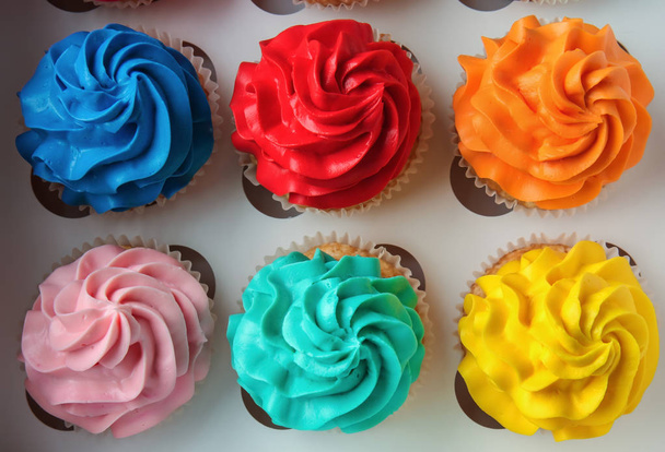 Colorful cupcakes in carton box - Photo, Image