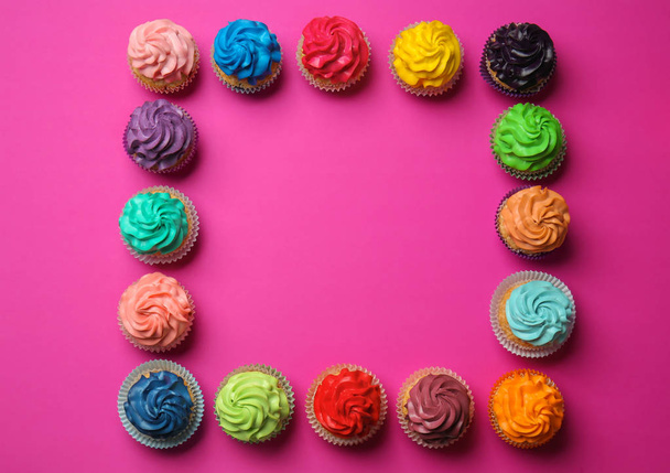 Frame made with different cupcakes on color background - Photo, Image