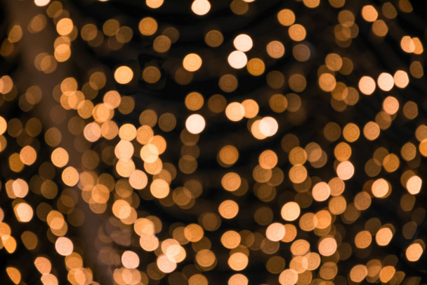 Blurred garland. City night light blur bokeh, defocused background. Christmas abstract pattern. - Foto, immagini