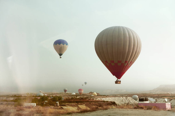 Travel. Beautiful Hot Air Balloon Flying In Sky Above Valley - Фото, зображення