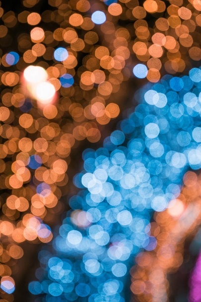 Blurred blue garland. City night light blur bokeh, defocused background. Abstract pattern. - Foto, afbeelding