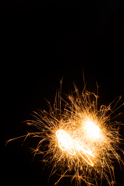 close-up view of bright burning new year sparkler on black background   - Фото, зображення
