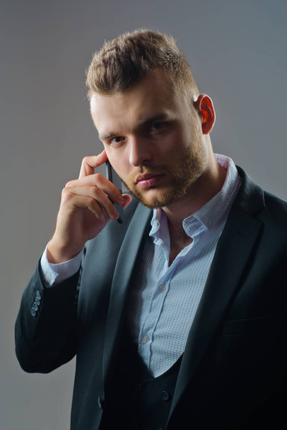 Businessman in work with phone mobil. Luxury classic suits, vogue. Man suit fashion. Meeting phone. - Fotografie, Obrázek