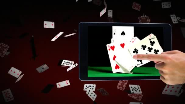 Businessman using digital tablet showing falling poker cards against glowing red technology animated background with falling poker cards - Imágenes, Vídeo