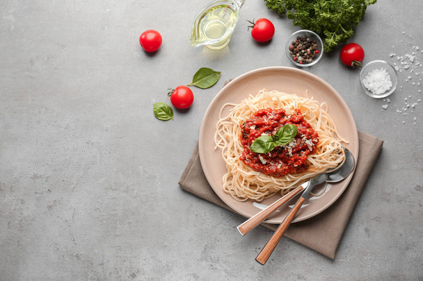 Plate with delicious pasta bolognese on grey table - Photo, Image