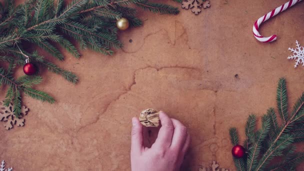 Human hand putting crumpled envelope. Happy Christmas stopmotion. - Footage, Video