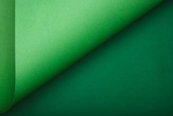 top view of green paper on colored background - Photo, Image