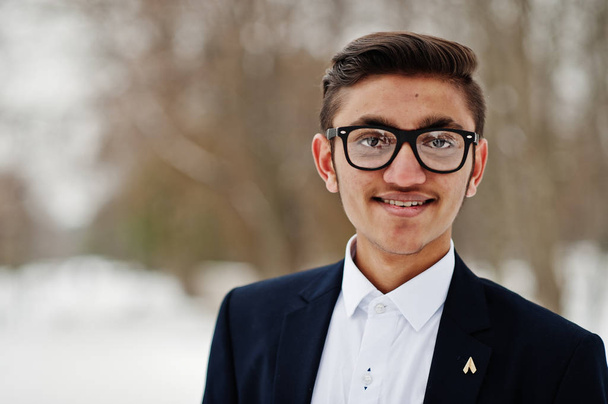 Close up portrait of stylish indian student man in suit and glasses posed at winter day outdoor. - Photo, image