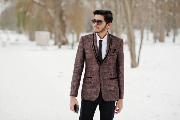 Stylish indian student man in brown suit and sunglasses posed at winter day outdoor. - Φωτογραφία, εικόνα