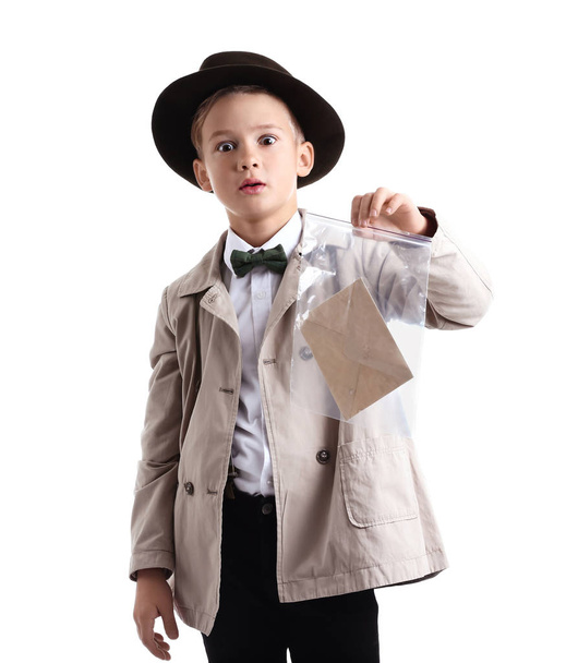 Cute little detective with evidence on white background - Foto, Imagen