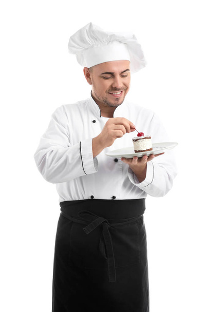 Αρσενικό σεφ με νόστιμο επιδόρπιο σε λευκό φόντο - Φωτογραφία, εικόνα