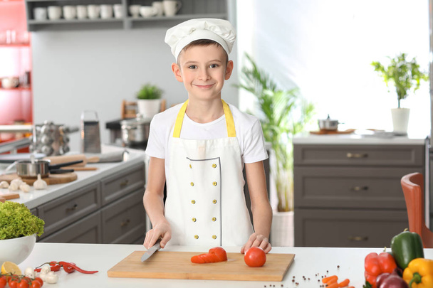Cute little chef in kitchen - Foto, Bild