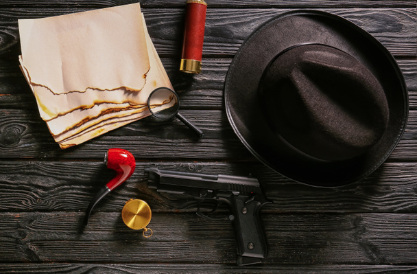 Composition with different items for detective on wooden background - Фото, зображення