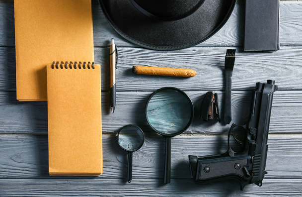 Composition with different items for detective on wooden background - Photo, Image