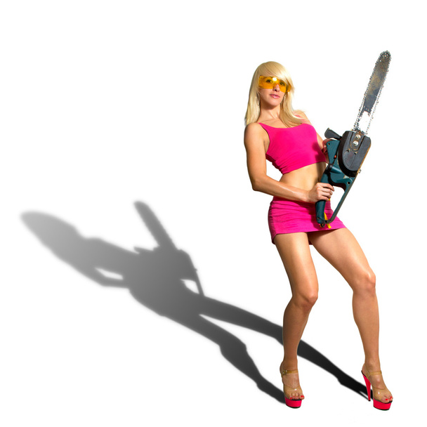 Sexy Girl holding a chainsaw - Foto, afbeelding