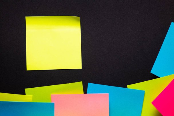 Many colorful sticky notes on black background - Photo, Image