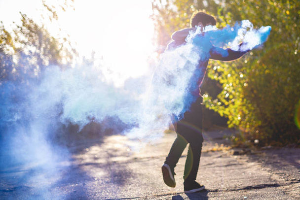 smoke bomb urban lifestyle concept running and jumping f - Photo, image