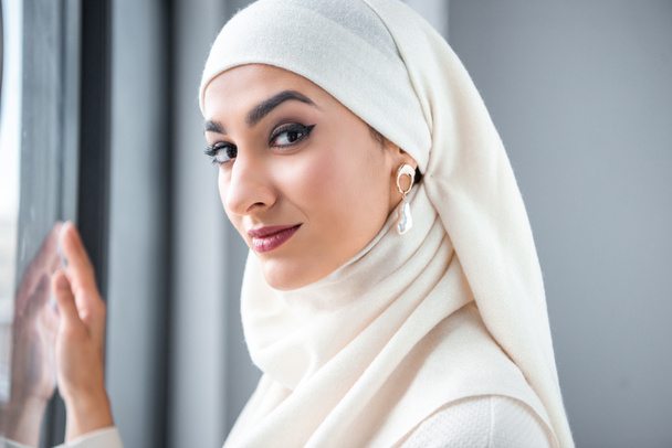 portrait of beautiful young muslim woman smiling at camera  - 写真・画像