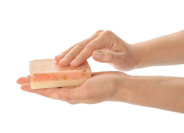 Female hands with soap bar on white background - Foto, imagen