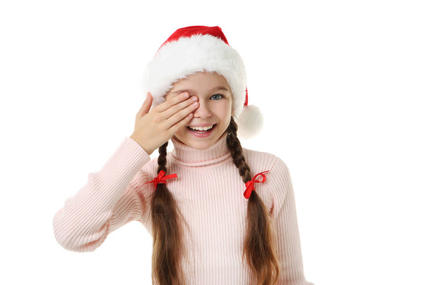 Young girl in santa hat on white background - Fotografie, Obrázek